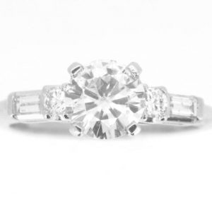 6.5MM Moissanite & .20TCW/4 SI1 GH Baguette & Round Diamonds Ladies Engagement Ring Platinum
