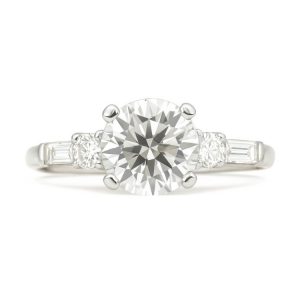 6.5MM Moissanite & .20TCW/4 SI1 GH Baguette & Round Diamonds Ladies Engagement Ring Platinum