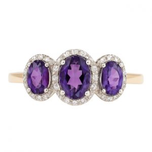 Gen. Amethyst Oval 6x4/5x3 & .17TCW Diamond Trio Ladies Ring 10KT