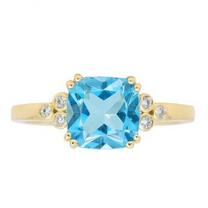 Gen. Blue Topaz Cushion 7mm & .06TCW Diamond Ladies Ring 10KT