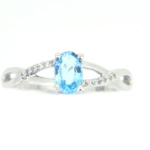 Gen. Blue Topaz 6x4 & .05TCW Diamond Accented Infinity Design Ladies Ring 10KT WG