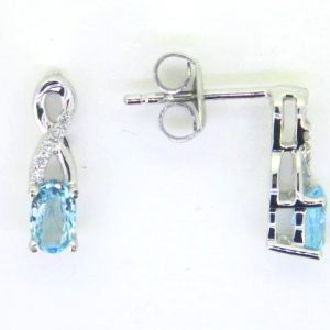 Genuine Blue Topaz 5x3 & .05TCW Diamond Accented Infinity Design Stud Earrings 10KT WG   *FINAL SALE*