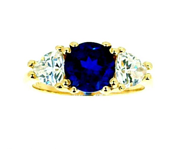 Simulated Blue Sapphire 7MM Round with Cubic Zirconia Trillion Accents Ladies Ring 10KT