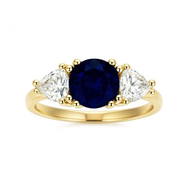 Simulated Blue Sapphire 7MM Round with Cubic Zirconia Trillion Accents Ladies Ring 10KT